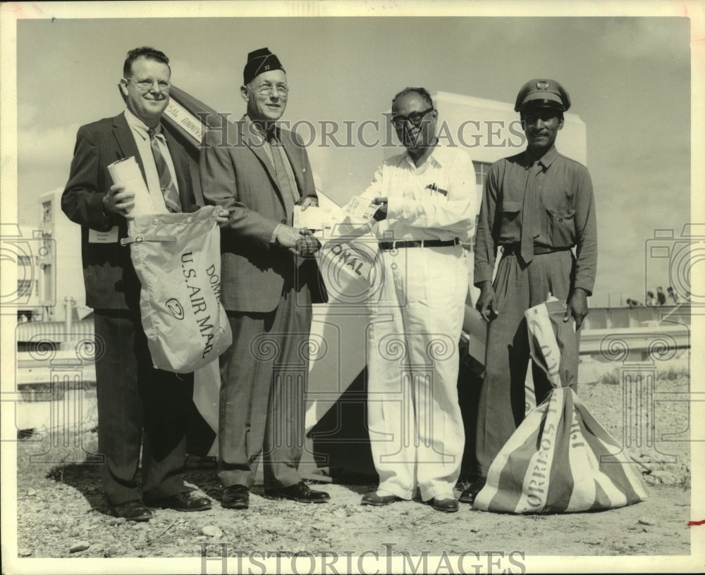 1961 Press Photo Men hold U.S. Air Mail bags in McAllen, Texas - hca37630-Historic Images