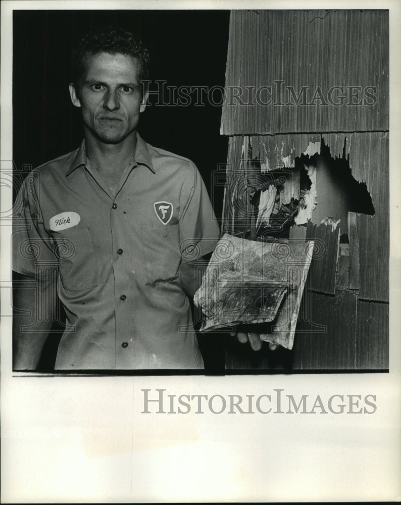 1969 Nick Narvaez shows explosion damage to his La Marque, TX home - Historic Images