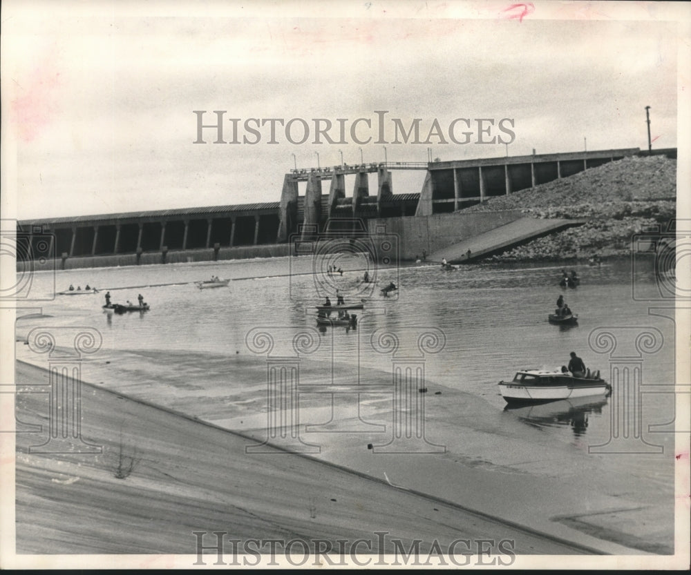 1964 Small fishing boats in water below Lake Houston Dam in Texas - Historic Images