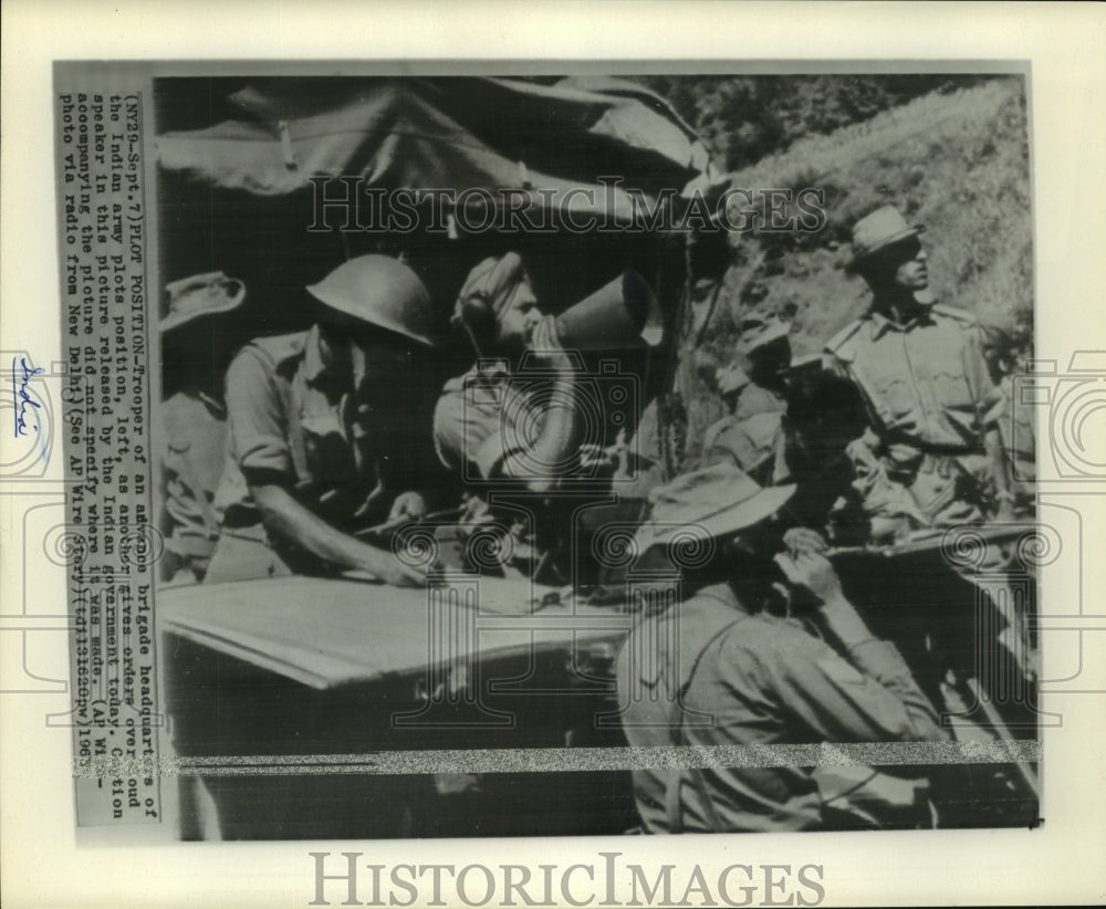 1965 Indian army soldier gives orders through speaker - Historic Images