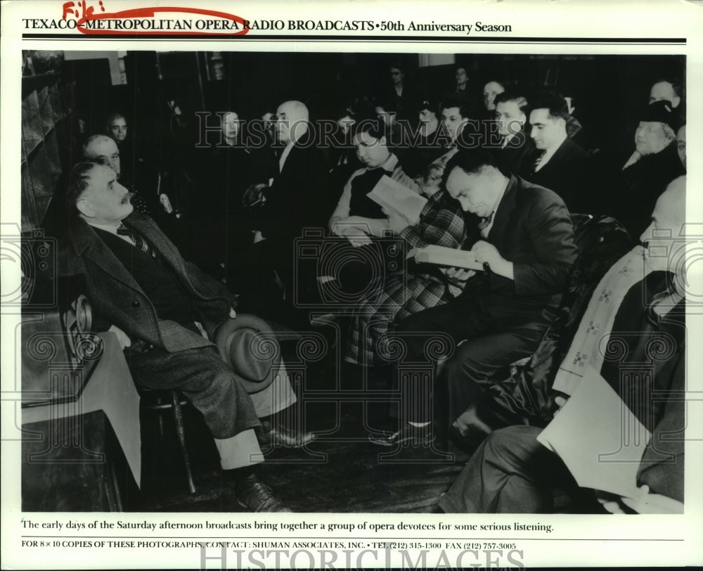 Group listens to Texaco-Metro Opera Radio Broadcast - Historic Images