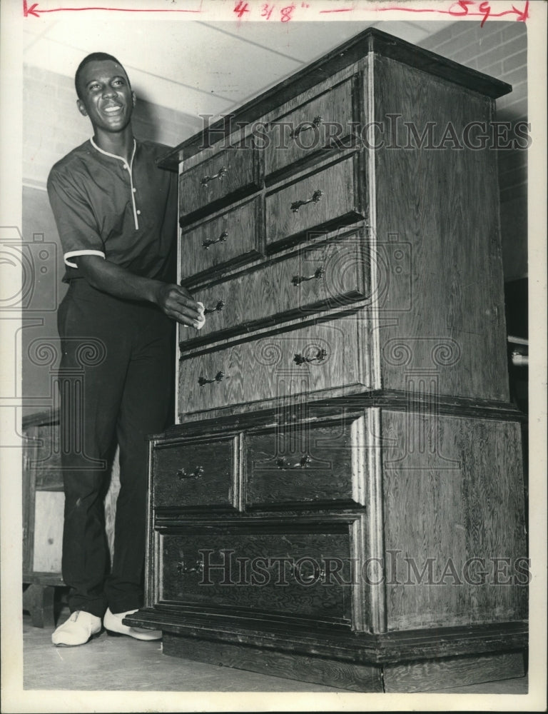 1966 Press Photo Charles Dickerson polishes chest of drawers; New Waverly, Texas - Historic Images