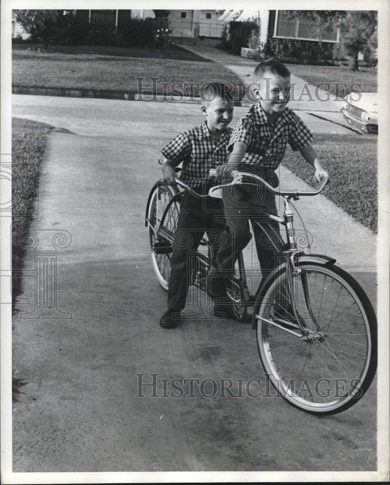 1962 David and Donald Clay on bicycle for two in Houston - Historic Images