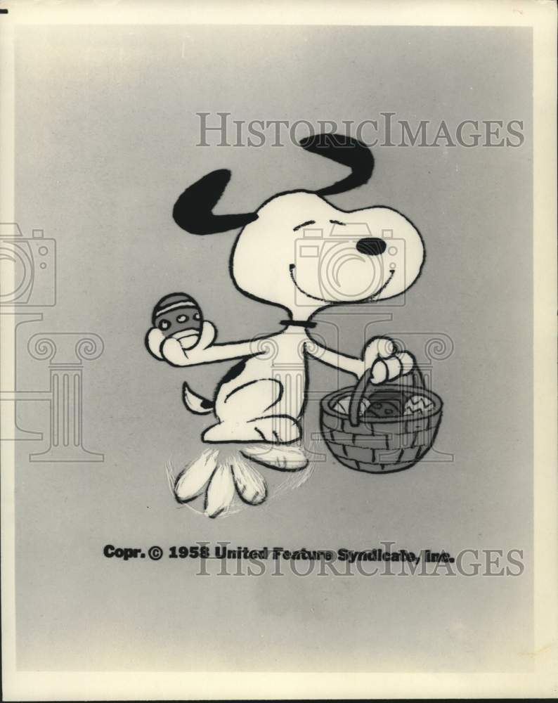 1958 Press Photo Snoopy Collects Easter Eggs in His Basket in This Cartoon - Historic Images