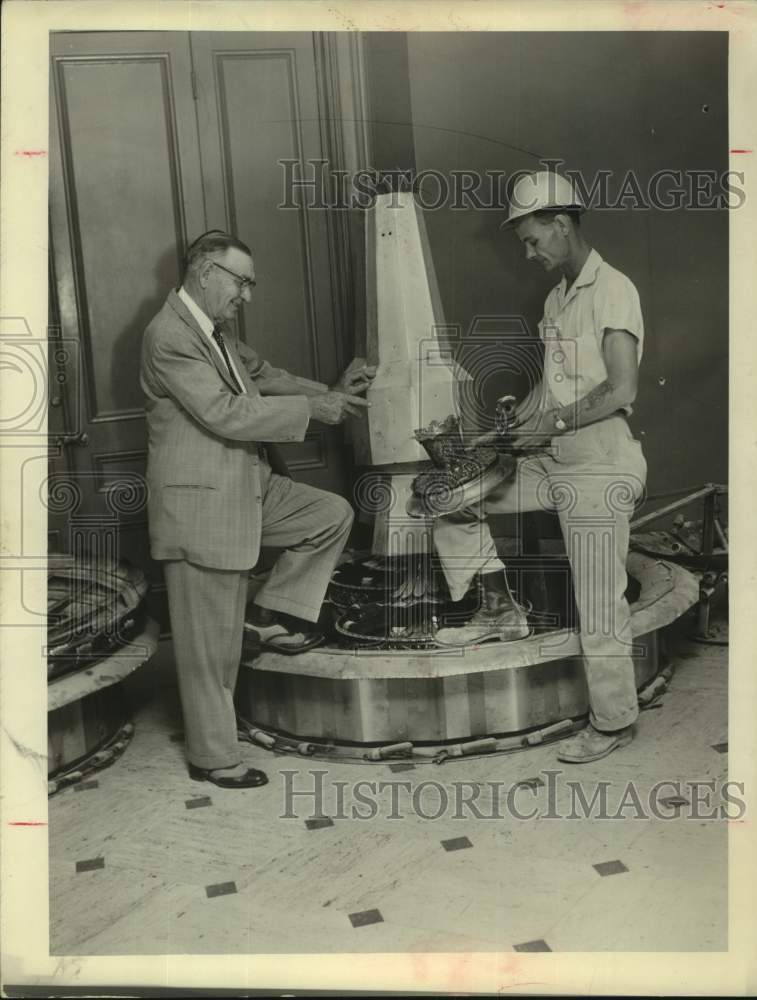 1957 Workman dismantles fountain at Rice Hotel, Houston-Historic Images