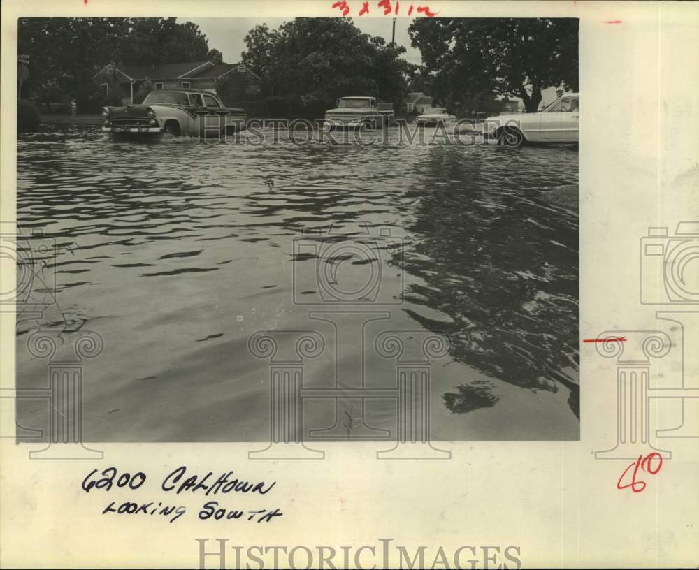1966 Houston motorists brave swirling waters at 6200 Calhoun-Historic Images