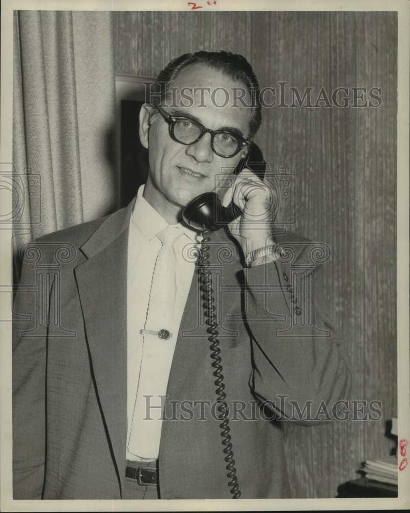 1957 Bill Bryan, KTRH radio manager, talking on telephone-Historic Images