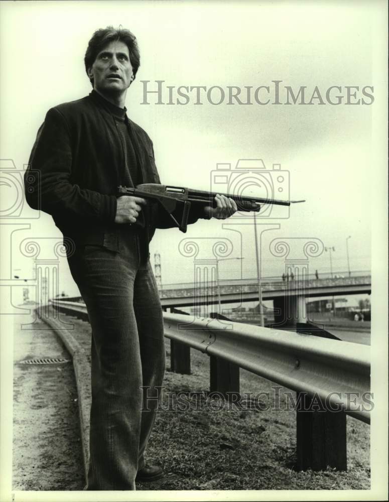 1987 Press Photo Joseph Cortese with gun in scene from &quot;C.A.T. Squad&quot;- Historic Images