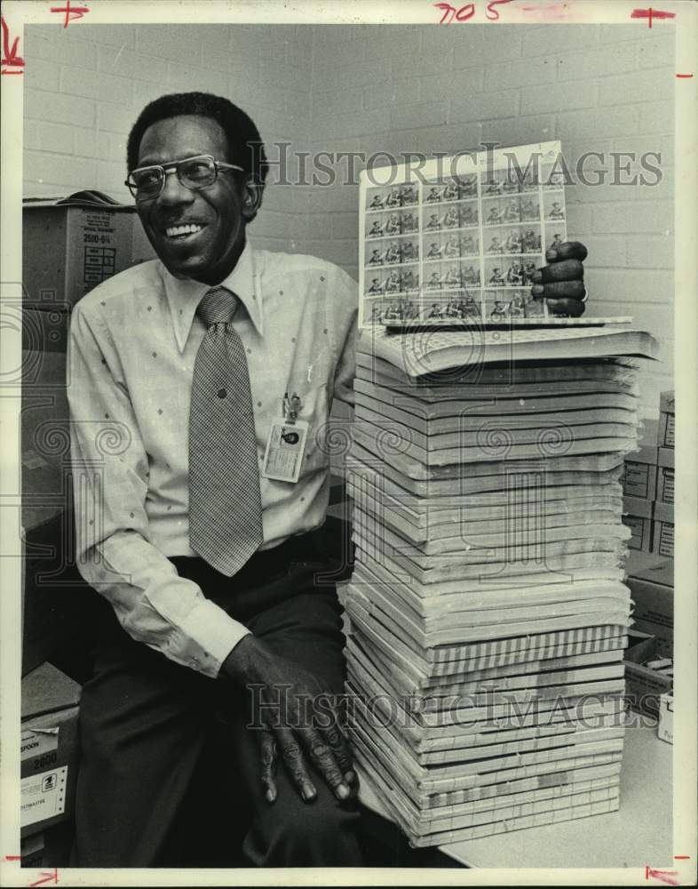 1976 Charles Coleman, postal worker, with stack of 13 cent stamps - Historic Images