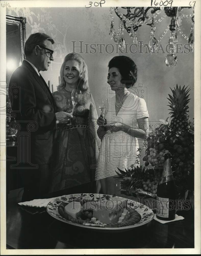 1969 Betty DeMontrond with Friends has Champagne at Gathering - Historic Images