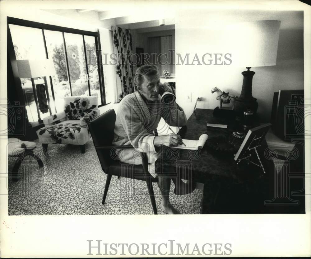 1969 Actor Kirk Douglas takes notes while on telephone-Historic Images