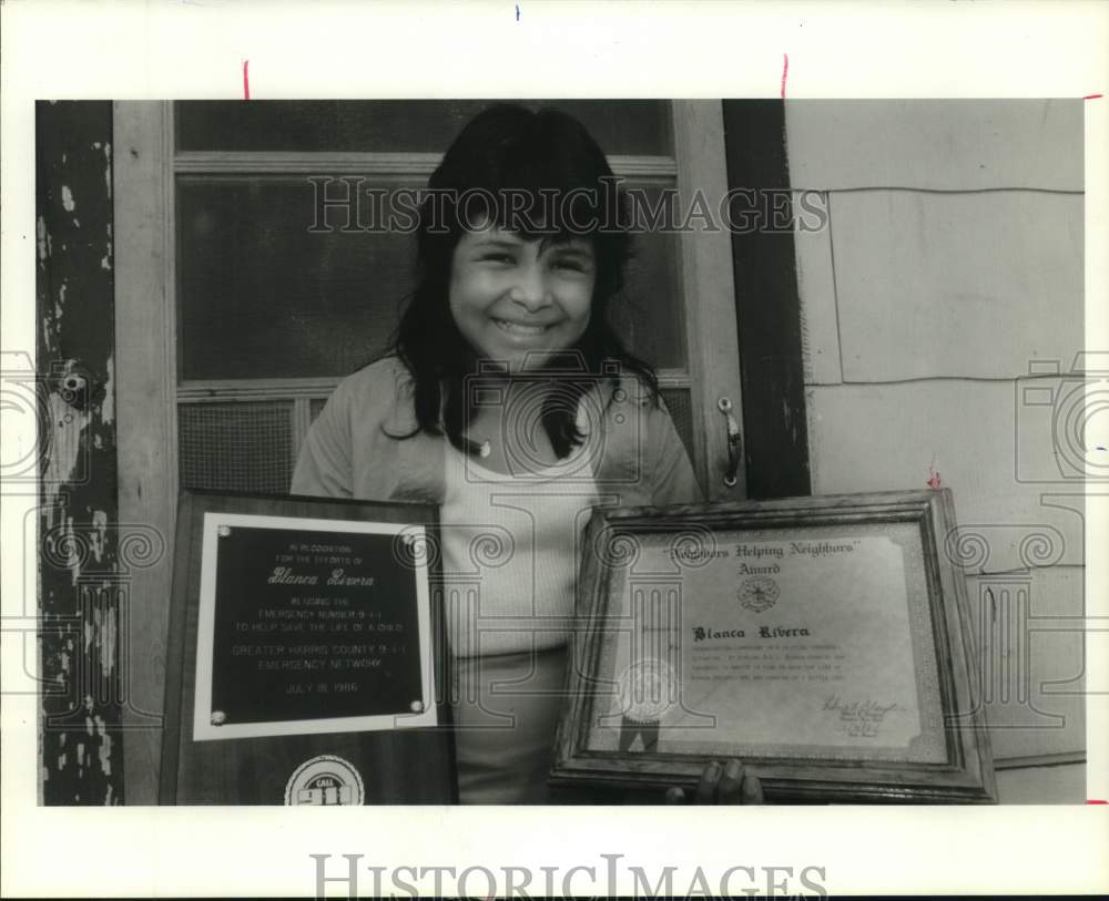 1986 Blanca Rivera with awards for helping to save a baby's life-TX - Historic Images
