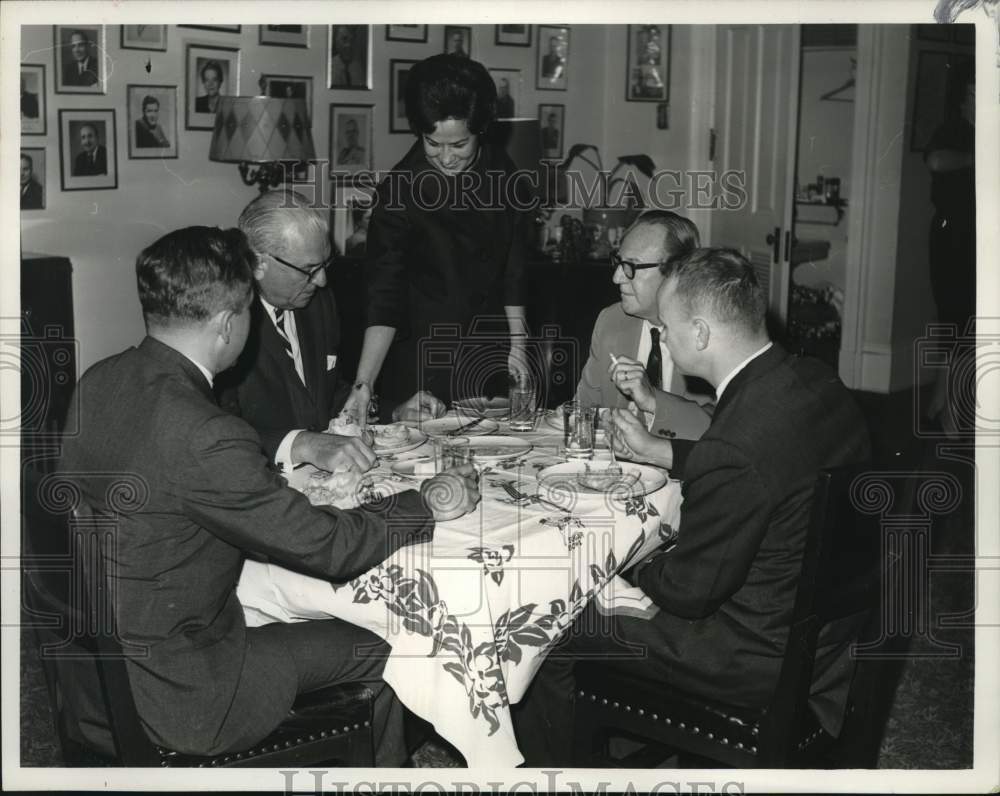 1963 Mrs. Edward Hebert serves meal to husband and other politicians-Historic Images