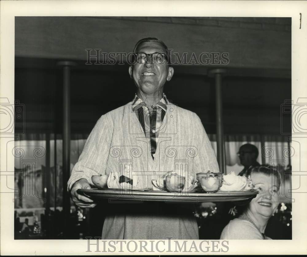 1957 Houstonian Earl Hankamer with a tray at restaurant in Phoenix.-Historic Images