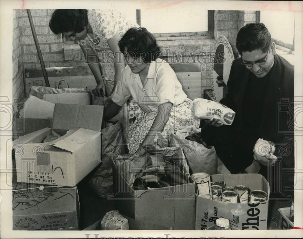 1966 Houston church members pack clothes, goods for striking workers-Historic Images