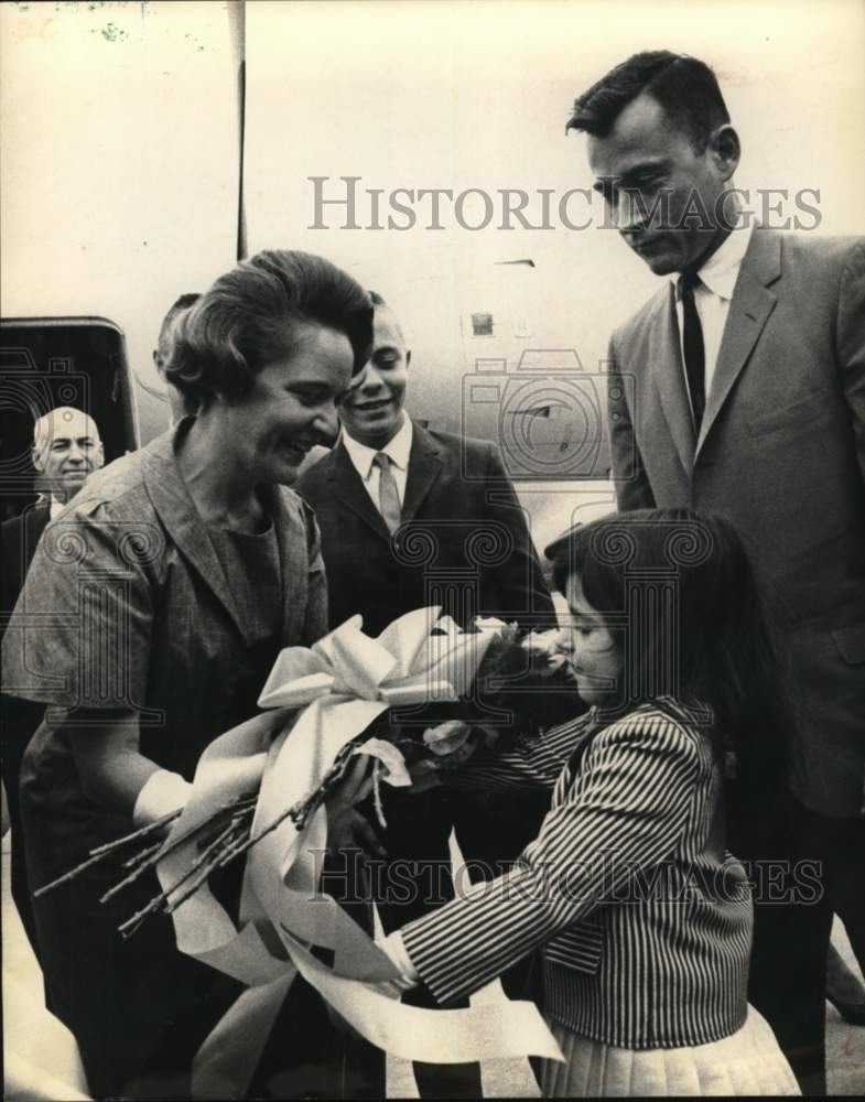 1965 Girl named Tina gives flowers to Mrs. Gus Grissom-Historic Images