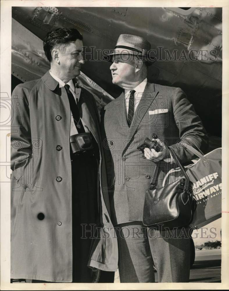 1961 Marvin Hurley talks with Caldwell McFadden in Houston airport-Historic Images