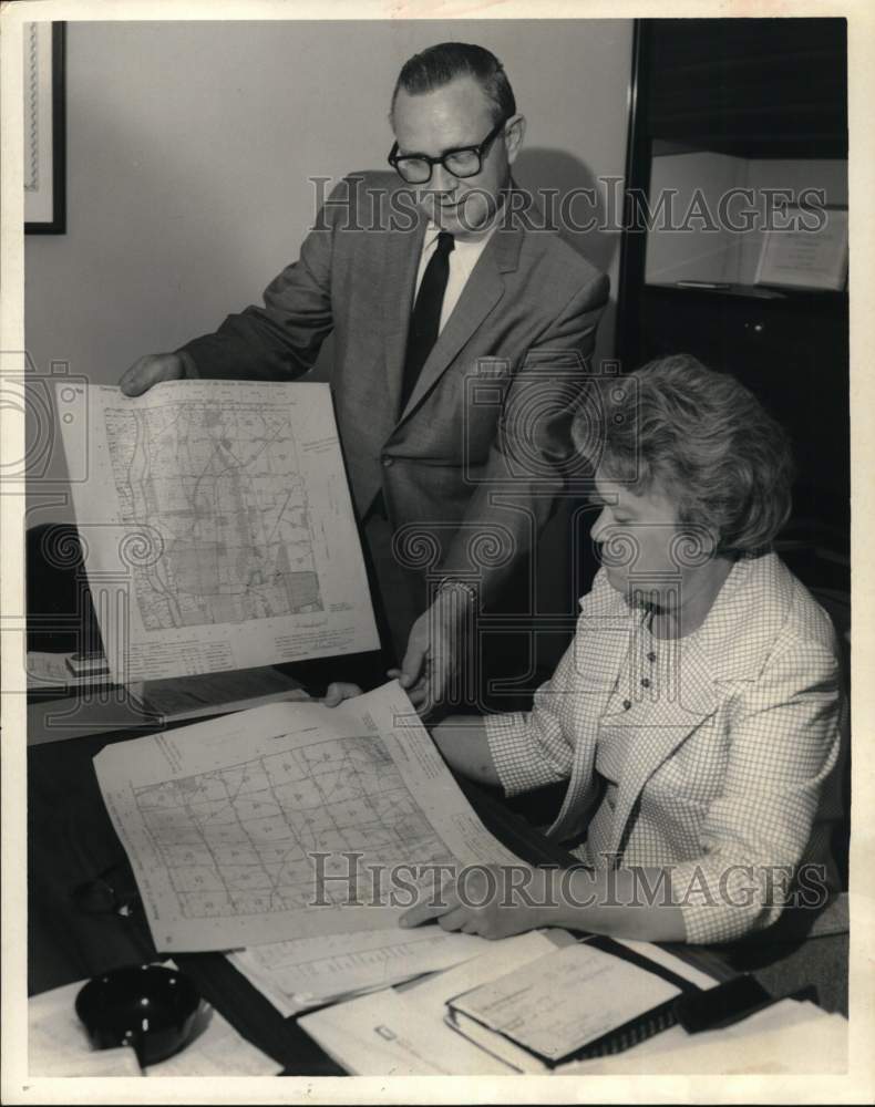 1966 Carl Howard, Allie Beth Martin examine plats, Tulsa Library, OK-Historic Images
