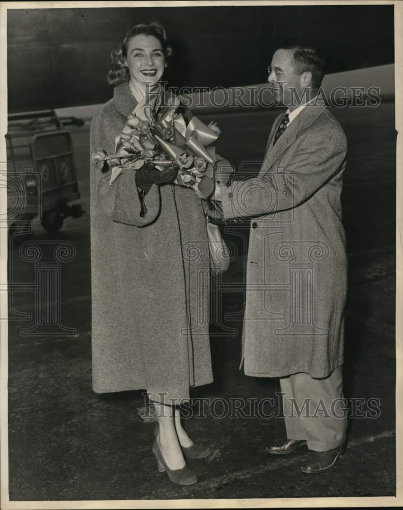 1951 Man gives flowers to Coleen Kay Hutchins-Historic Images