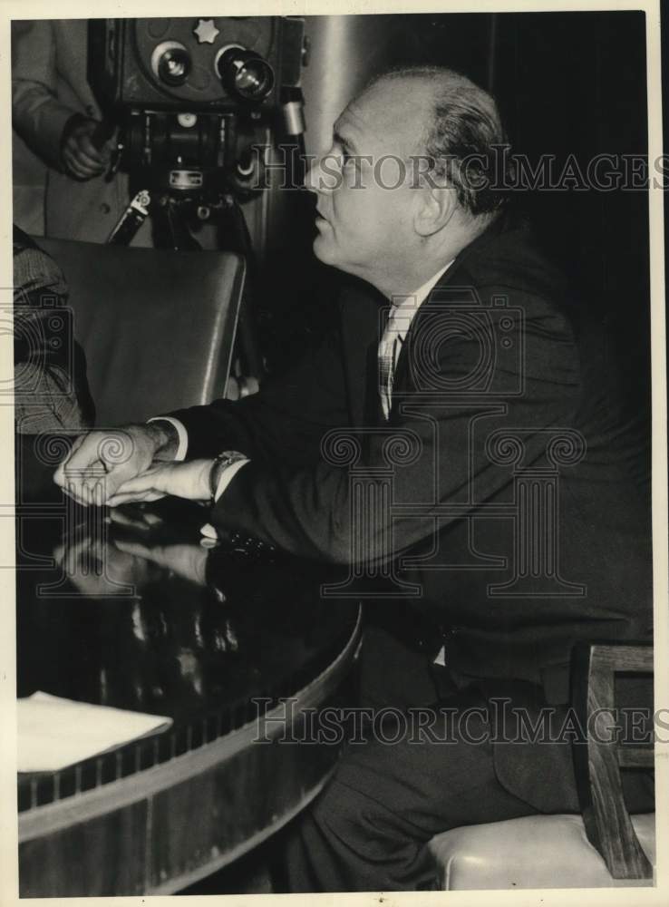 1957 Man being filmed while sitting at table-Historic Images