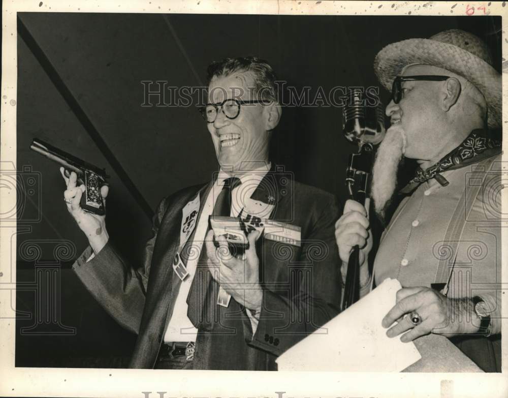 1960 Harris County Sheriff C.V. Kern holding a pistol at event-Historic Images