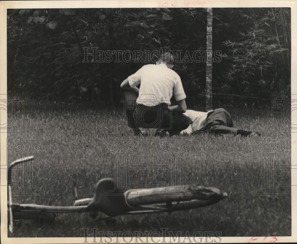 1963 Roy Jacobs collapses after finding bodies - neighbor assists-Historic Images