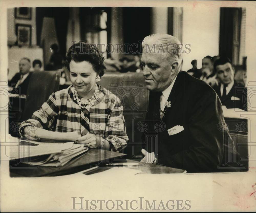 1961 Mrs. Virginia Ferris gets opinion from Rev. Clinton Kersey.-Historic Images