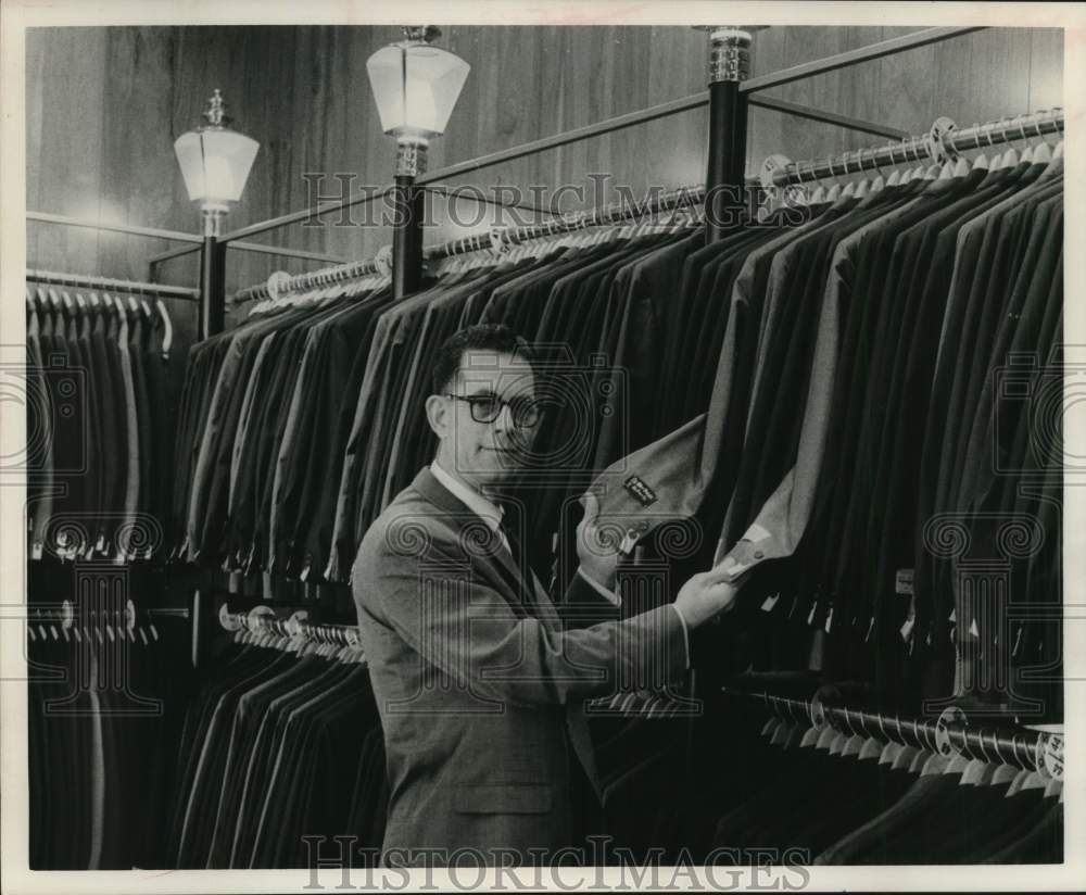 1963 Morris J. Lichtenstein manager of Benjamin's with wool suits.-Historic Images