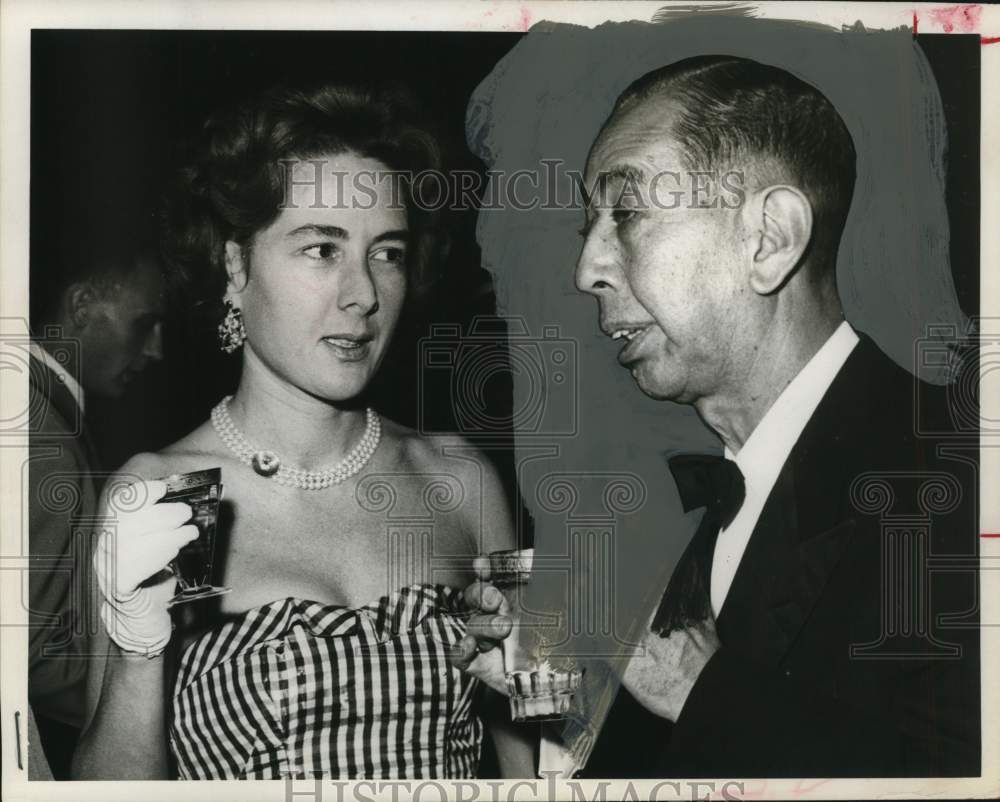 1960 Japanese Prime Minister Nobusuke Kishi talking to young woman.-Historic Images