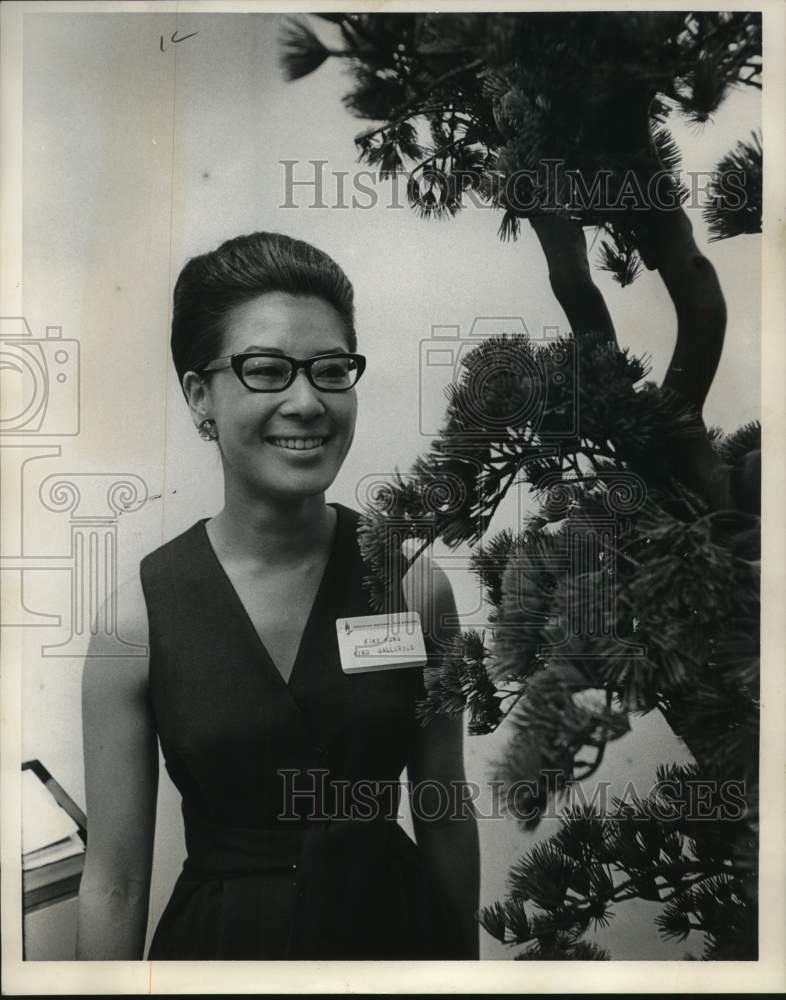 1967 Mrs. David Kung poses with Bonsai tree, Texas-Historic Images