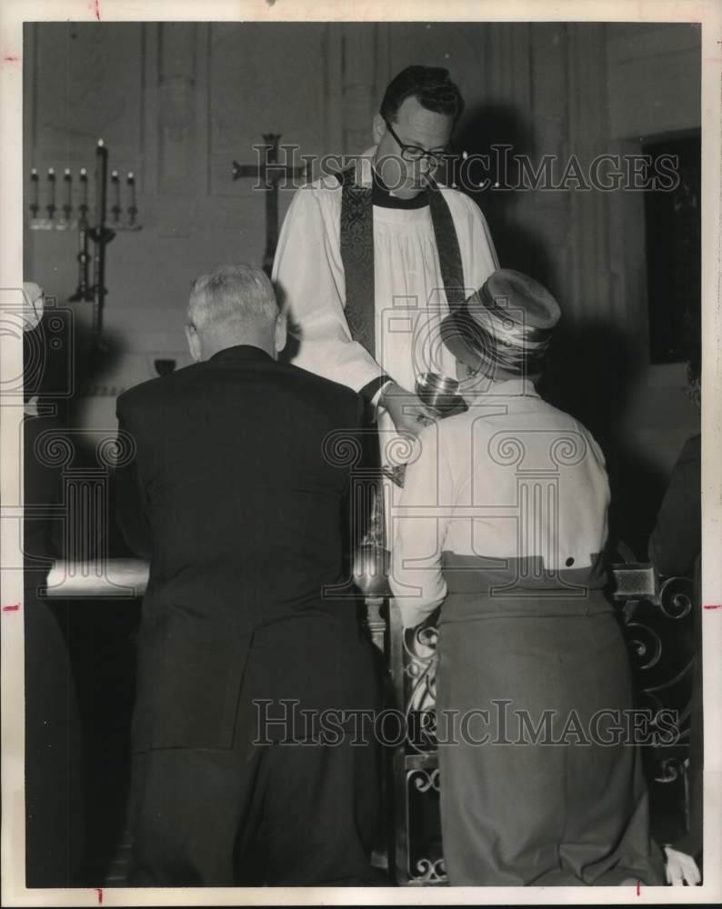 1961 Reverend Arthur Knapp serves kneeling Communicant, Texas-Historic Images