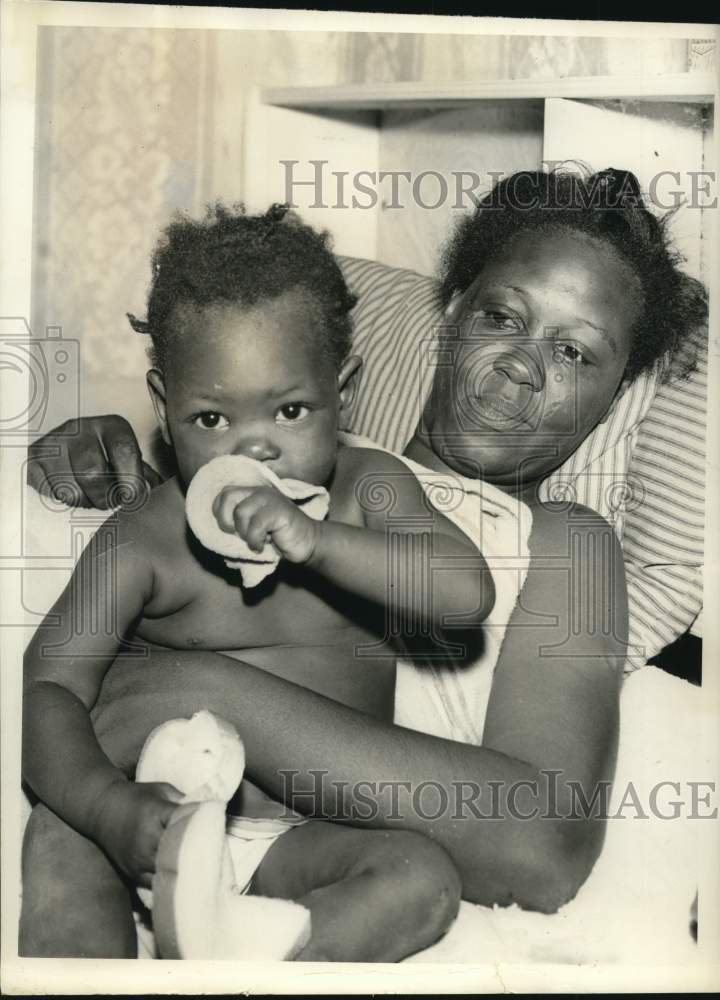 1957 Mrs. Lewis, 1-year-old daughter Shirley, eating balony-Historic Images