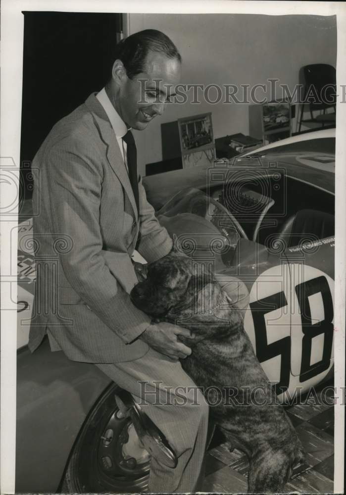 1964 Press Photo Fernando Segura poses with dog and automobile - hcb25670 - Historic Images