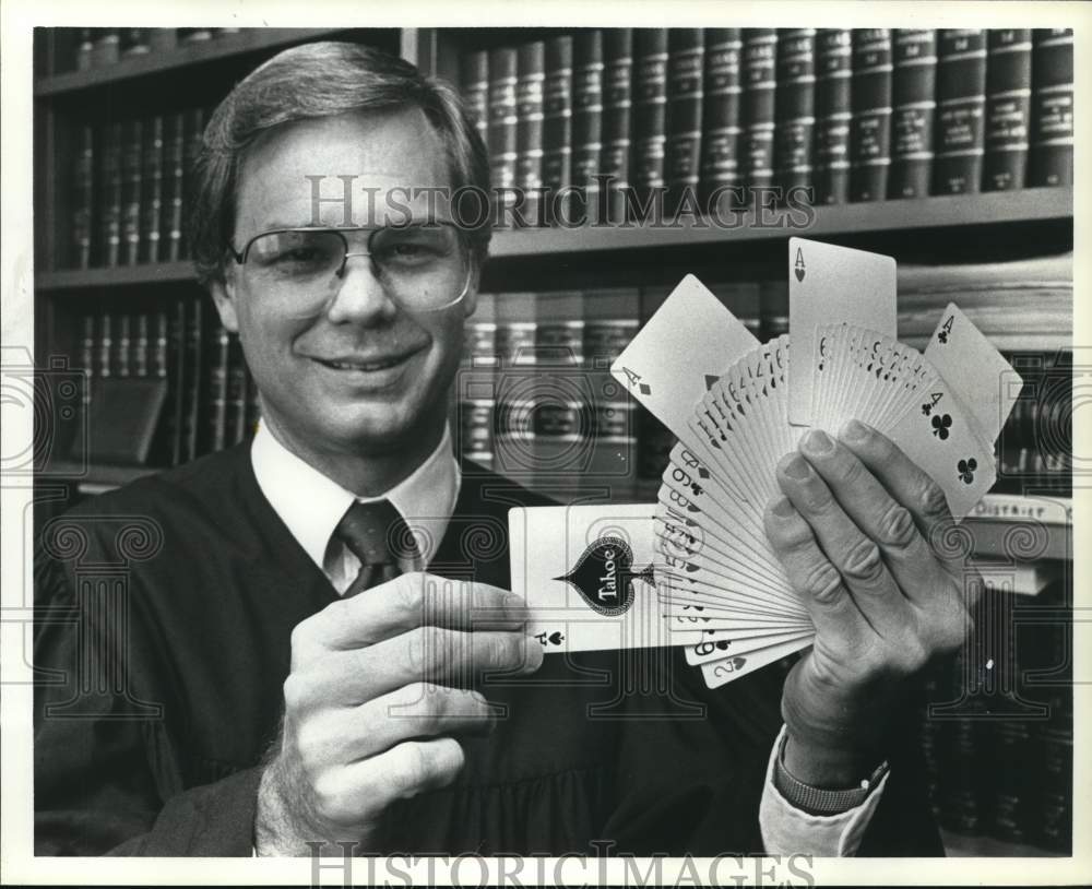 1985 Press Photo Judge Frank Price holds playing cards - hcb28936 - Historic Images