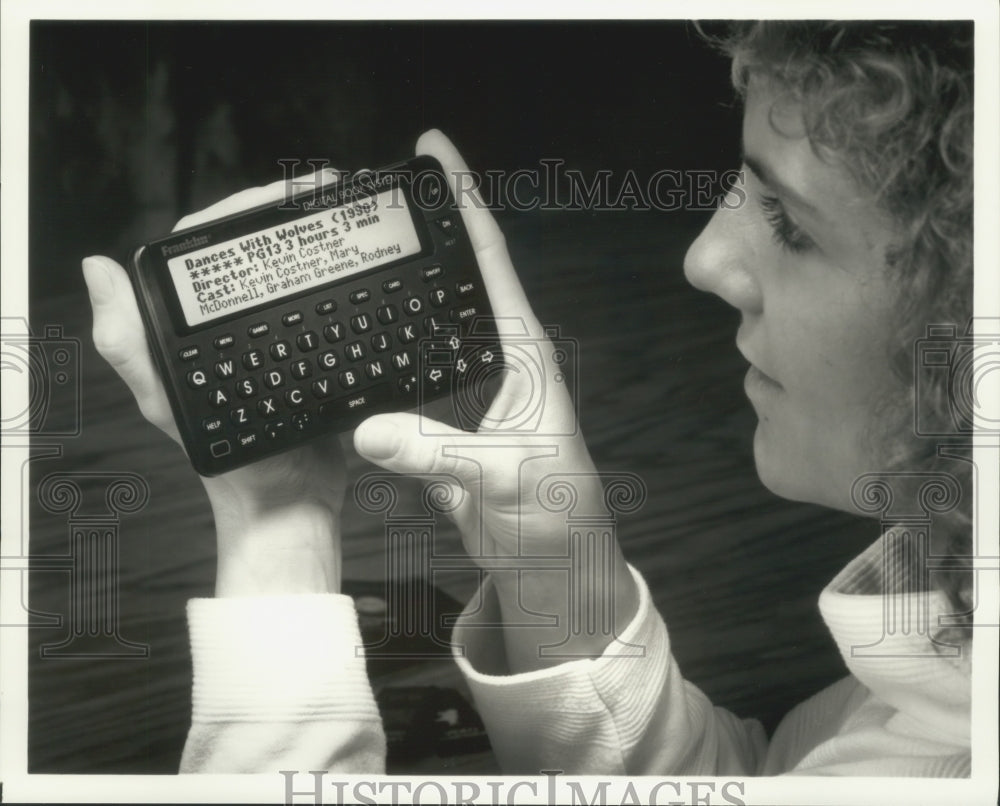 1993 Press Photo Woman holds Digital Book System that holds digital books - Historic Images