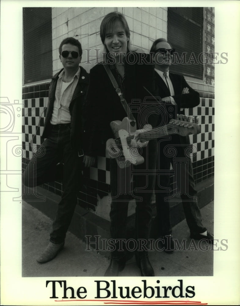 1989 Members of the  music group The Bluebirds with a guitar - Historic Images