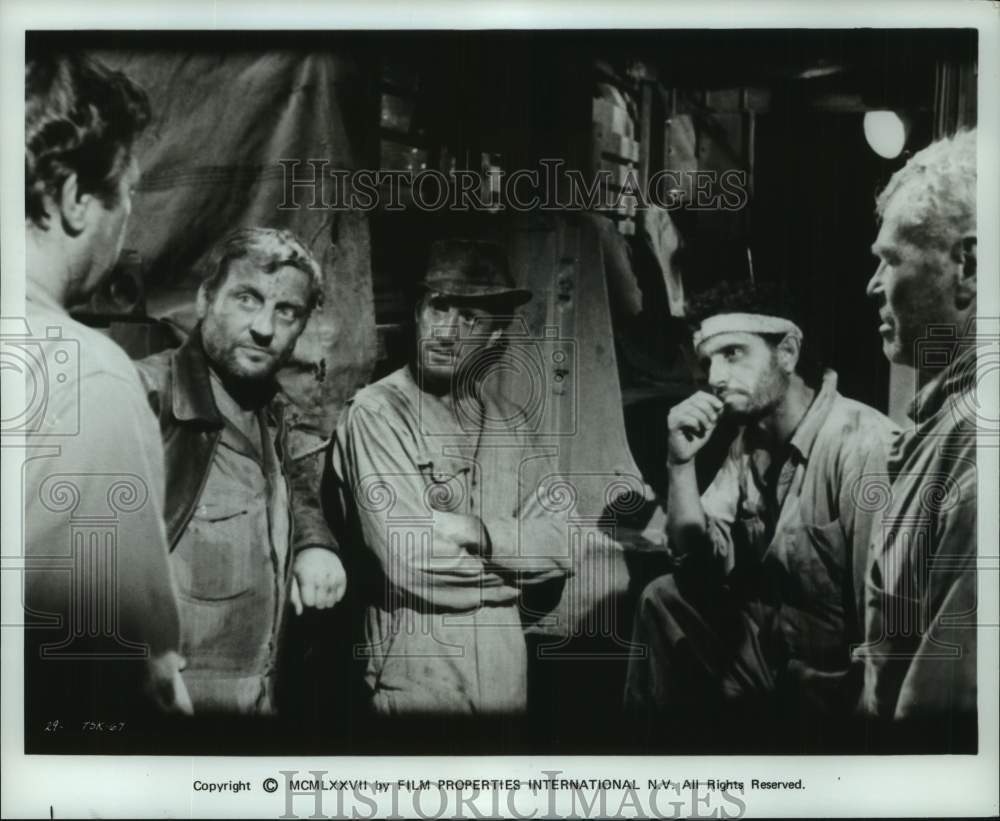 1977 Press Photo Group meeting scene from the movie "Sorcerer" - Historic Images