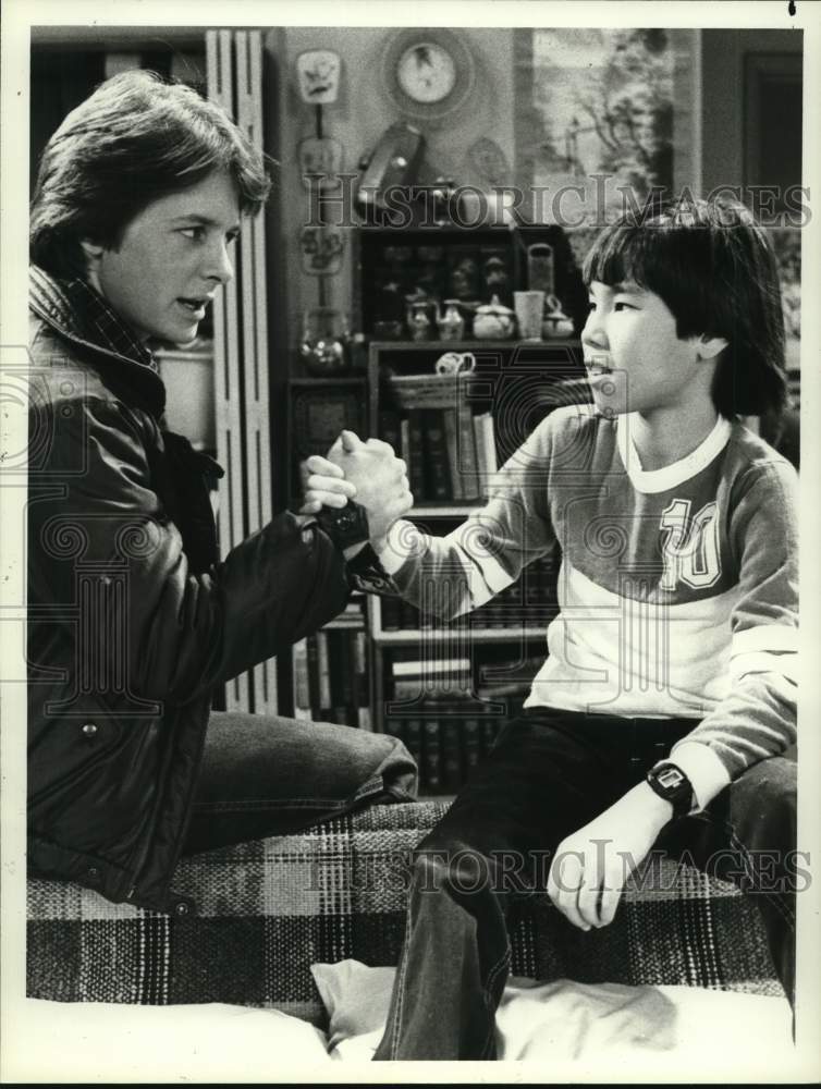 1983 Press Photo Michael J Fox and Eugene Akutagawa in "Family Ties" - Historic Images