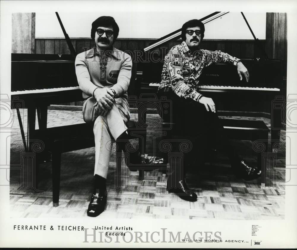 1976 Piano duo Ferrante & Teicher sitting at pianos. - Historic Images