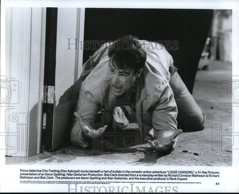 1990 Press Photo Actor Dan Aykroyd Ducks Bullets in &quot;Loose Cannons&quot; - hcq13657- Historic Images