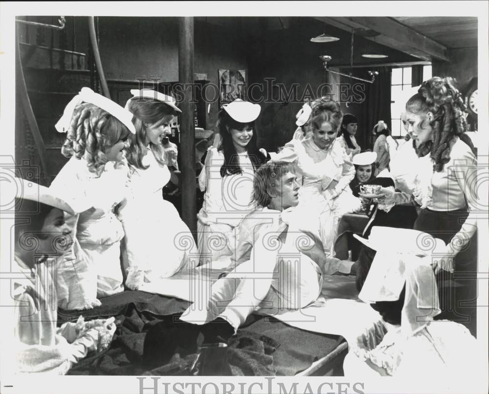 Press Photo Man Surrounded by Women in Movie Scene - hcq16747- Historic Images