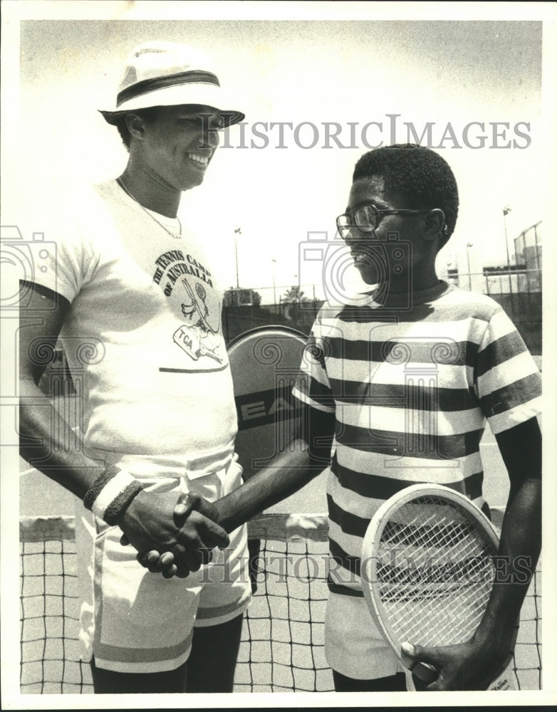 1977 Press Photo Rodney Evans (11) meets tennis Champion Arthur Ashe - hcs00715- Historic Images