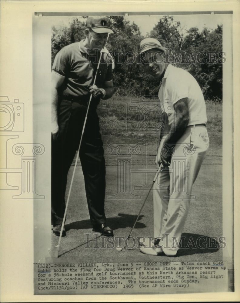 1965 Tulsa football coach holds flag for Kansas State coach tourney - Historic Images