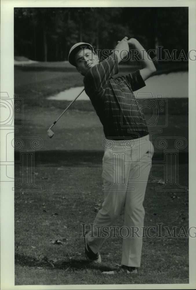 1987 Press Photo Golfer hits iron shot from fairway. - hcs05145 - Historic Images