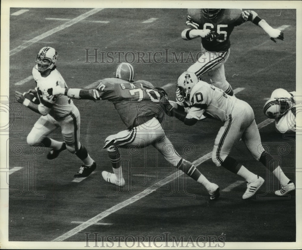 1973 Patriots quarterback Jim Plunkett sacked by Oilers' Tody