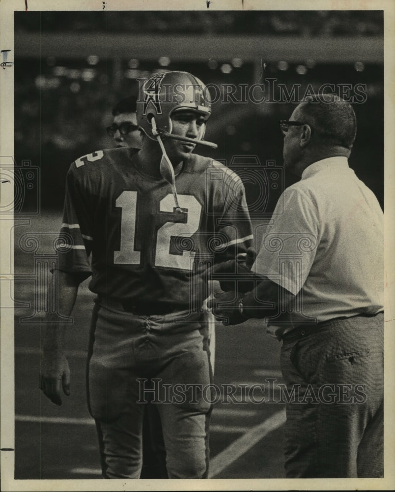 1970 Houston Oilers&#39; quarterback Charley Johnson talks to coach Lemm - Historic Images