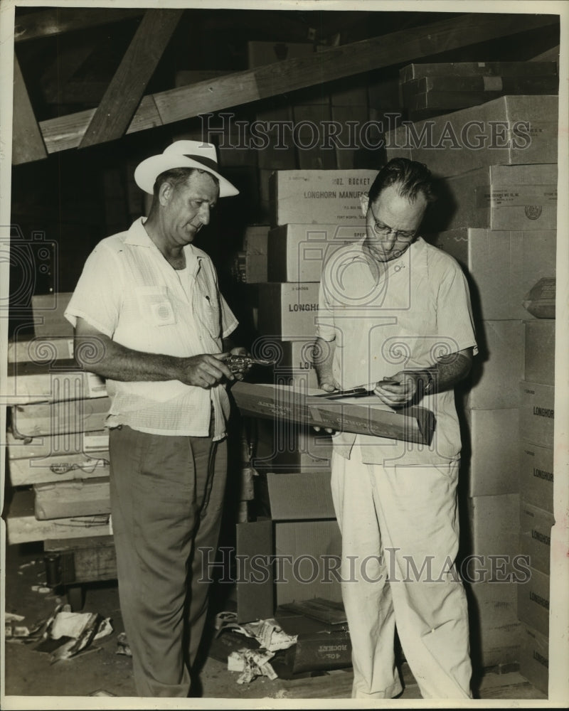 1953 Press Photo Workers at ALCO Fireworks inspect fireworks in warehouse. - Historic Images