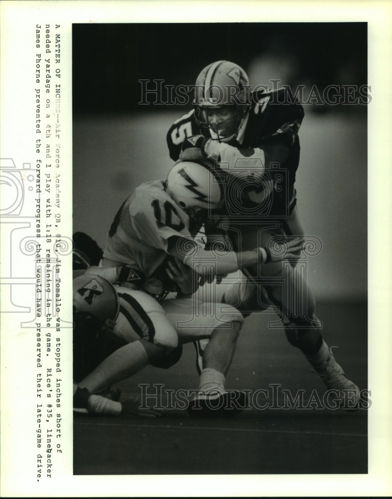 1986 Press Photo Rice&#39;s James Phorne stops Air Force&#39;s Jim Tomallo short of goal- Historic Images