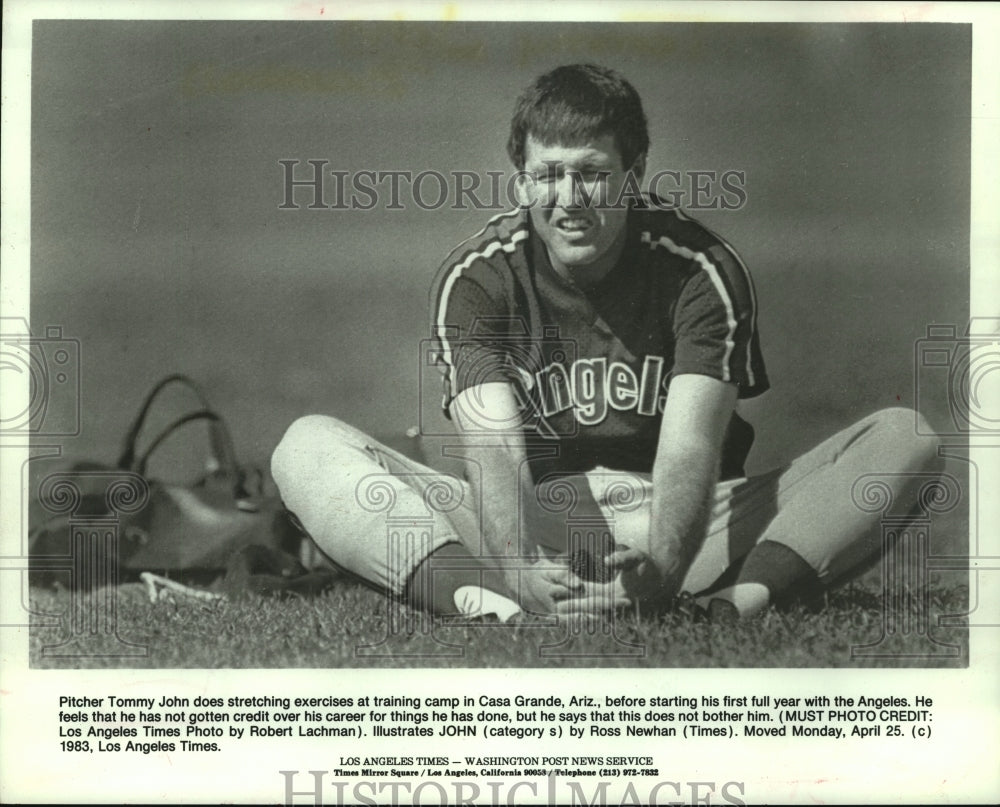 1984 Press Photo California Angels pitcher Tommy John stretches at training camp- Historic Images