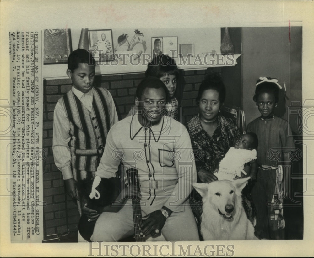 1970 Heavyweight boxing champion Joe Frazier poses with his family. - Historic Images